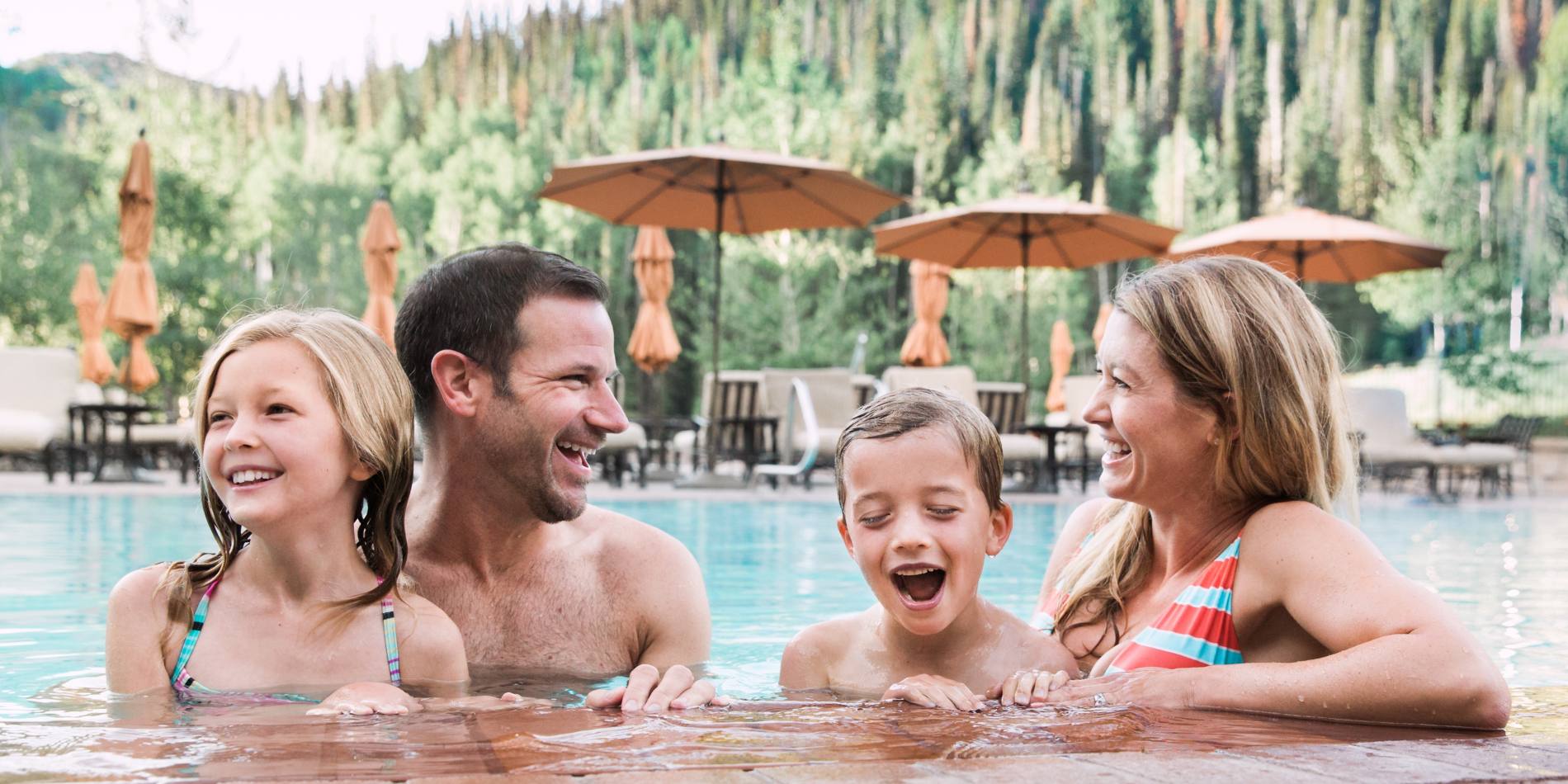 Family of four at the pool