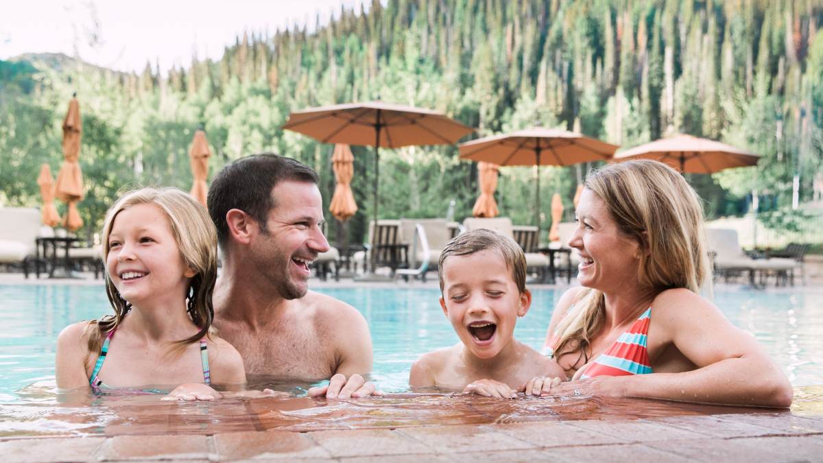 Family of four at the pool